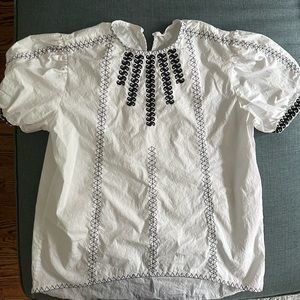White blouse with black detail